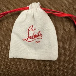 Christian Louboutin extra heel replacements with the pouch.